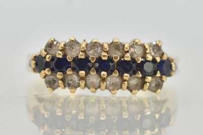 Lot 1315 - A 9ct gold dress ring, with a central line of...