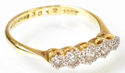 Lot 762 - An 18ct yellow gold ring with five graduated...