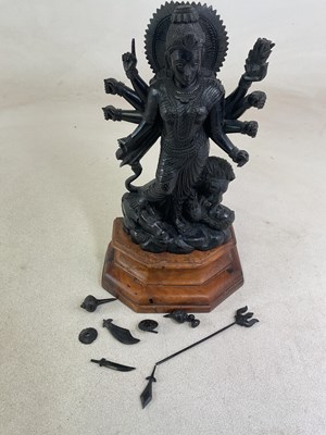 Lot 256 - An Indian carved ebony figure of Devi Durga...