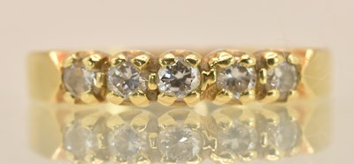 Lot 1277 - An 18ct yellow gold diamond set ring, the...