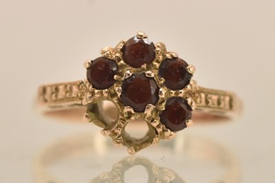 Lot 1318 - A 9ct rose gold ruby cluster ring, size O,...