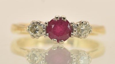 Lot 1285 - An 18ct yellow gold ring set with central cut...