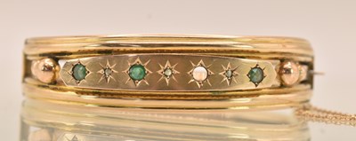 Lot 1456 - A late 19th century 9ct yellow gold hinged...