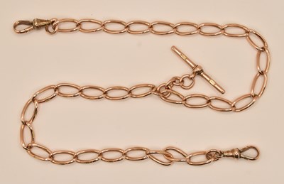 Lot 1143 - A 9ct rose gold elongated link watch guard,...