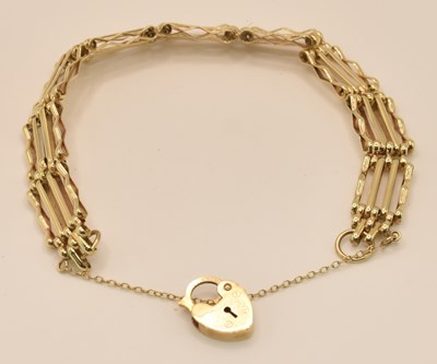 Lot 1457 - A 9ct yellow gold four bar gate link bracelet,...