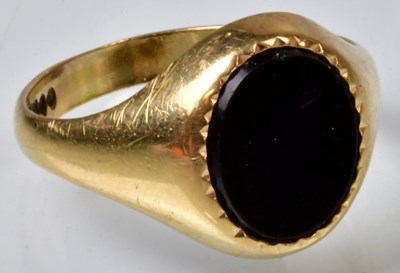Lot 775 - A 9ct yellow gold signet ring set with an oval...