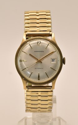 Lot 1632 - GARRARD; a gentleman's yellow gold wristwatch,...