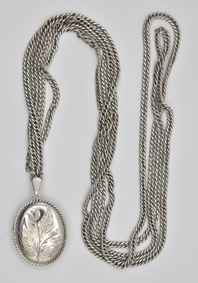 Lot 1393 - A hallmarked silver oval double locket, with...