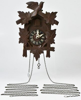 Lot 108 - A reproduction Swiss cuckoo clock with metal...