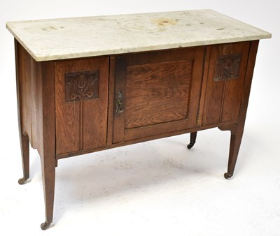 Lot 34 - An Arts and Crafts oak marble-topped...