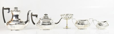 Lot 29 - A silver plated four piece tea service with...