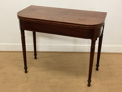 Lot 547 - A 19th century mahogany fold-over tea table,...