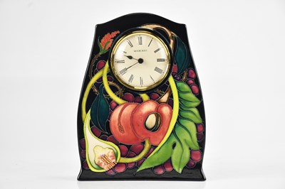Lot 35 - EMMA BOSSONS FOR MOORCROFT; a mantel clock in...