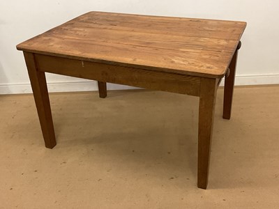 Lot 493 - An oak farmhouse kitchen table with a single...