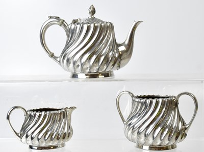 Lot 497 - A silver-plated three-piece tea set,...