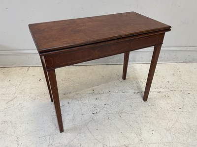Lot 1166 - An Edwardian mahogany inlaid fold-over tea...