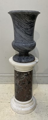 Lot 1219 - A large and impressive grey marble urn on grey...