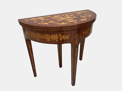 Lot 1054 - A reproduction inlaid demi-lune card table,...