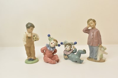 Lot 132 - NAO; four figures of boys, including two...