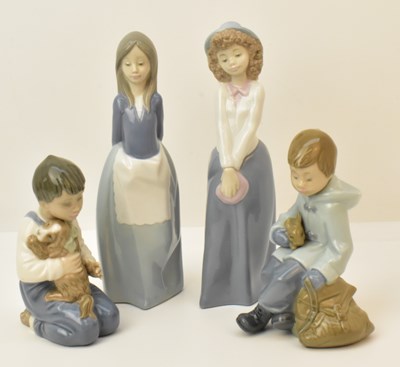 Lot 134 - NAO; four high gloss figures of children,...