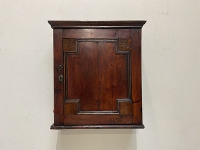 Lot 1032 - An 18th century oak spice cabinet, the...