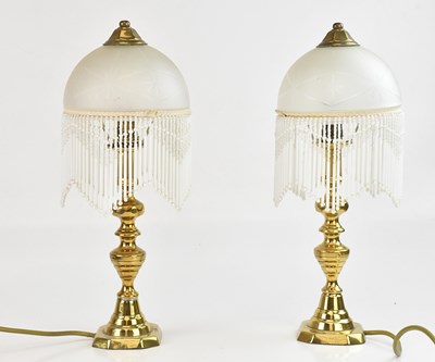 Lot 1337 - A pair of brass table lamps, height 39cm.