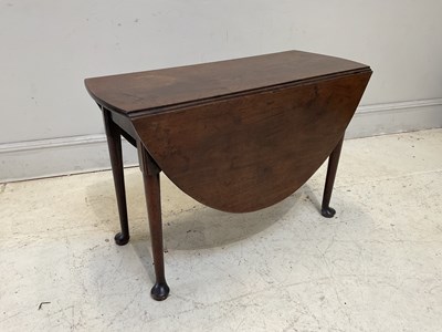 Lot 1110 - A George III mahogany drop-leaf dining table,...