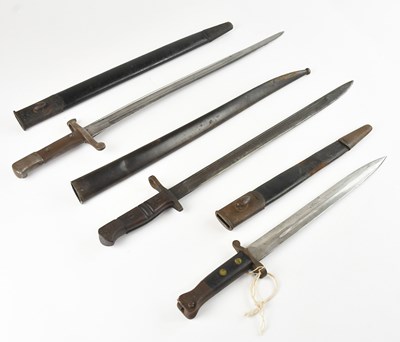 Lot 491 - A group of three bayonets comprising a French...