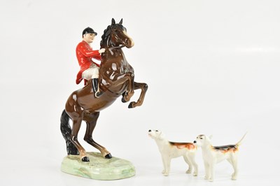 Lot 206 - BESWICK; a huntsman on rearing horse, height...