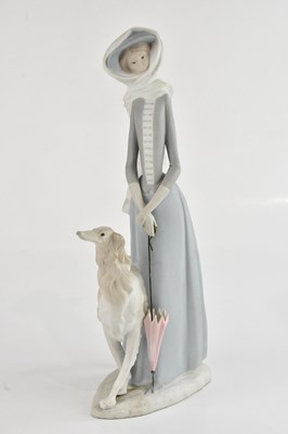 Lot 176 - LLADRÓ; a figure of a lady with a parasol and...