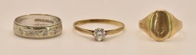 Lot 1243 - Three 9ct gold rings comprising a white gold...
