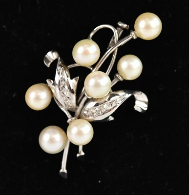 Lot 167 - A white metal pearl set brooch stamped '14K',...