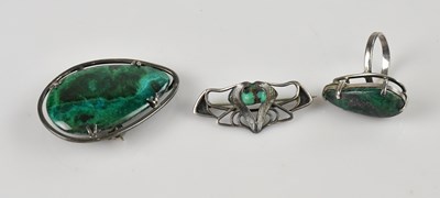 Lot 740 - A malachite brooch in white metal frame,...
