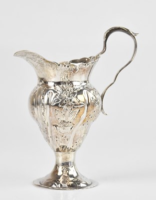 Lot 409 - A Georgian hallmarked silver cream jug