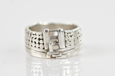 Lot 700 - A hallmarked silver gatepost ring, size U,...