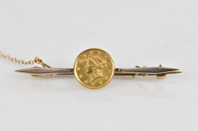 Lot 168 - An American gold one dollar coin dated 1853,...