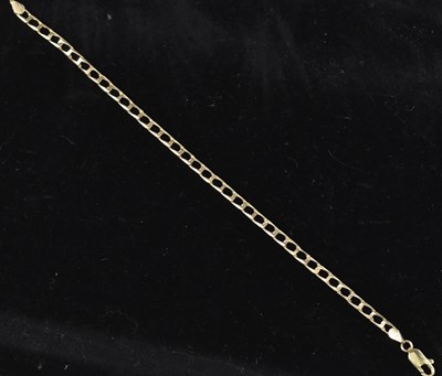 Lot 124 - An Italian 9ct yellow gold flat link bracelet,...