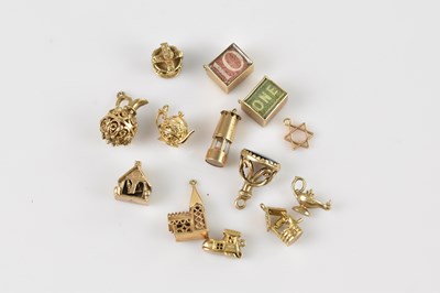 Lot 5 - Twelve 9ct yellow gold charms, combined approx...