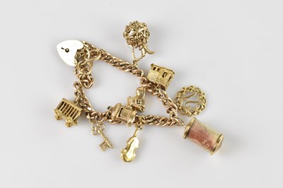 Lot 92 - A 9ct flat link bracelet, set with yellow...