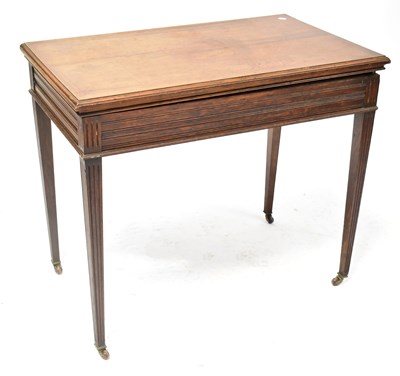 Lot 56 - An oak rectangular games table with lift-off...
