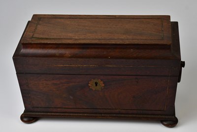 Lot 283 - A Regency rosewood tea caddy of sarcophagus...