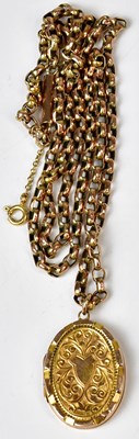 Lot 819 - A 9ct yellow gold oval pendant with engraved...