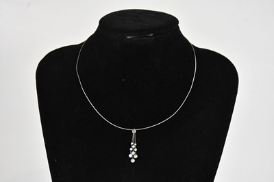 Lot 301 - CHRISTOPHER WHARTON; a white metal pendant set...