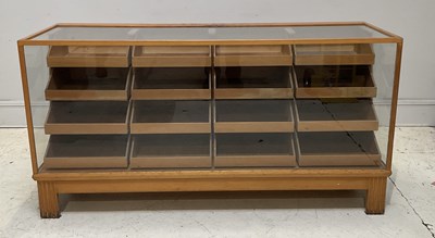 Lot 1061 - An oak sixteen drawer haberdashery cabinet,...