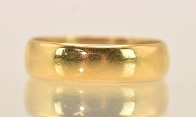 Lot 1203 - A 22ct yellow gold band ring, size P, approx 4....