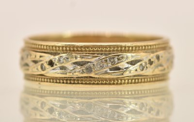 Lot 1274 - A 9ct two colour gold eternity ring, size P,...