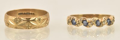 Lot 1223 - Two 9ct yellow gold dress rings, one with blue...