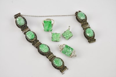 Lot 196 - A white metal and green hardstone plaque...