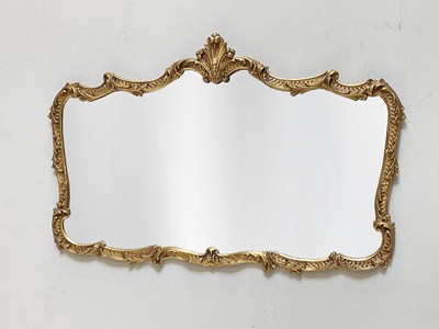 Lot 1186 - A Rococo style decorative gilt wall mirror, 68...