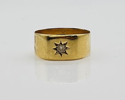 Lot 374 - An 18ct yellow gold broad wedding band set...
